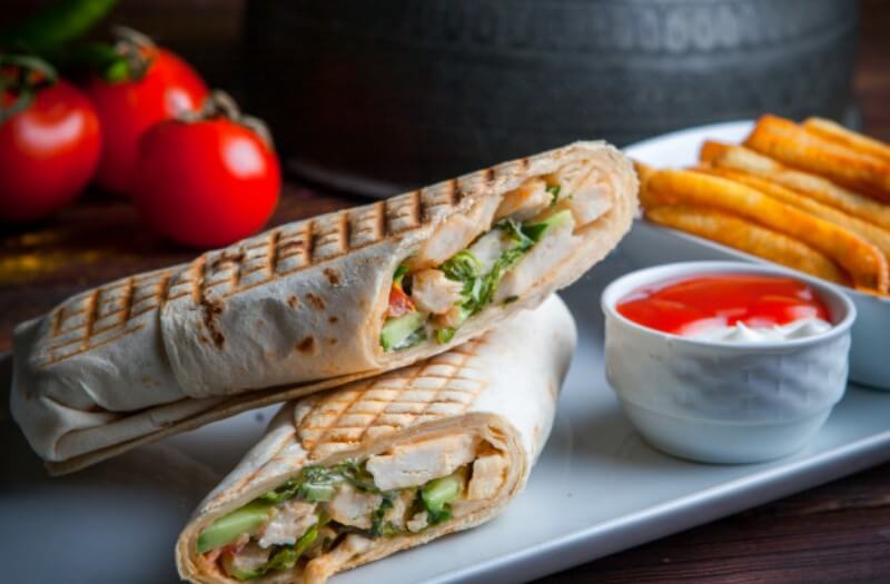 side-view-shawarma-pita-roll-with-chicken-fried-potatoes_176474-3216